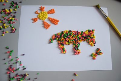 High angle view of multi colored candies on table