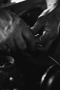 Close-up of hand holding cigarette