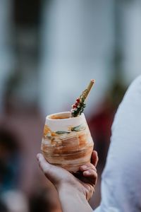 Close-up of hand holding ice cream