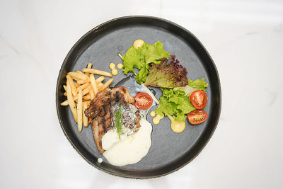 High angle view of food in bowl on white background