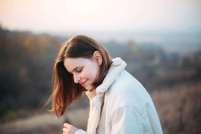 Portrait of a young woman on a sunny day in autumn