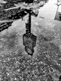 High angle view of wet snow on footpath