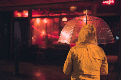 Portrait of woman holding umbrella