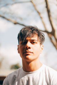 Close-up portrait of a serious young man