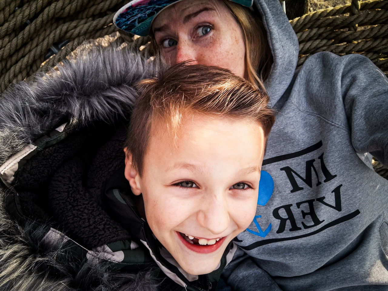 portrait, men, looking at camera, child, childhood, two people, emotion, togetherness, smiling, family, happiness, person, headshot, adult, positive emotion, front view, human face, fun, bonding, female, hat, clothing, lifestyles, winter, leisure activity, parent, love, one parent, women, toddler, warm clothing, cheerful, father, day, cute, outdoors