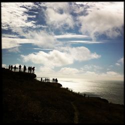 Scenic view of sea against cloudy sky