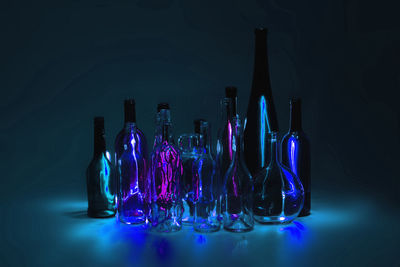 Close-up of bottles against black background