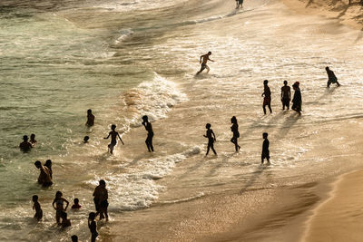 Large group of people on paciencia beach in the rio vermelho neighborhood of salvador, brazil. 