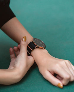 Close-up of woman hand on table