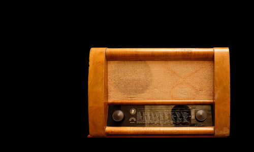 Telephone booth against black background