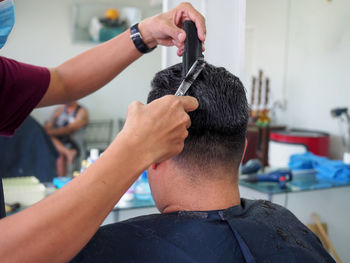 Hairdresser hairstyling male customer