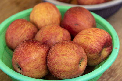 High angle view of apples in container on table