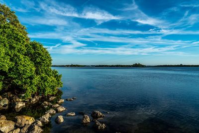 Scenic view of lake against blue sky