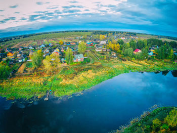 Scenic view of lake against cloudy sky