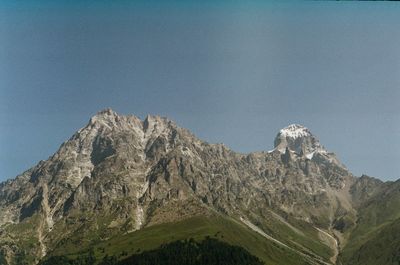 Scenic view of rocky mountains against clear sky