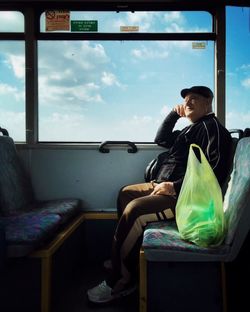 Young woman sitting in bus