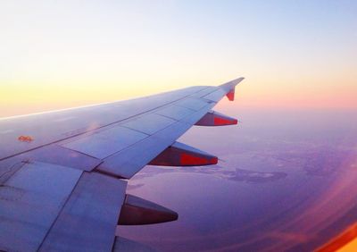 Cropped image of airplane flying over sea