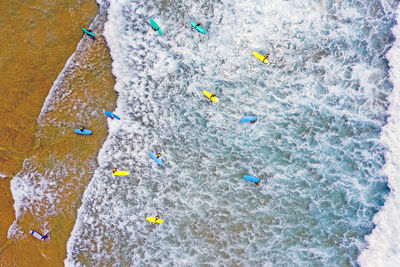 Aerial view of waves splashing in sea