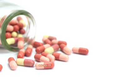 Close-up of candies on table against white background