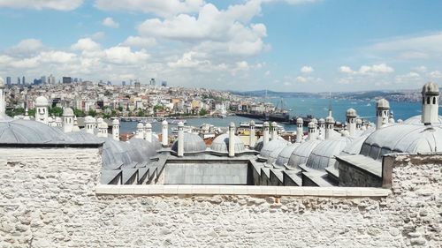 Panoramic view of beach and buildings against sky