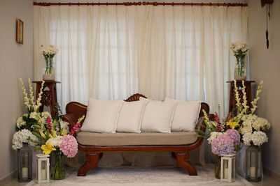 Flower vase on table at home