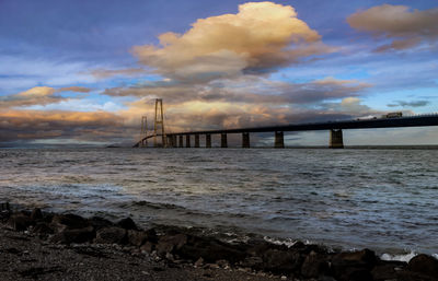 Bridge over sea against sky