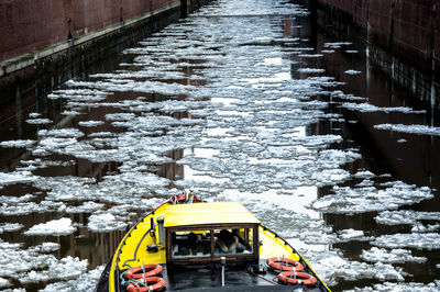 High angle view of boat on canal during winter