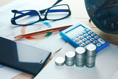 High angle view of coins on table