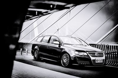 Car on road against sky in city