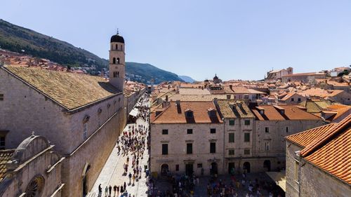 Buildings in town against clear sky