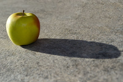 Close-up of apple on road