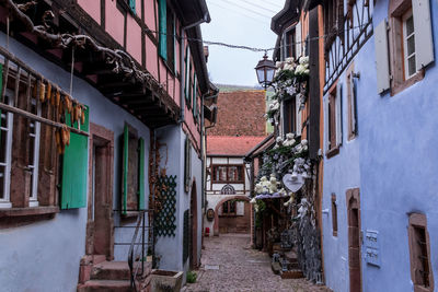 Narrow alley amidst buildings in city