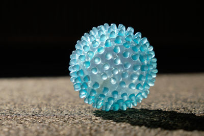 Close-up of blue ball on table