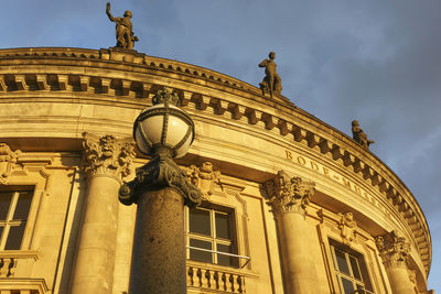 Low angle view of statue against building