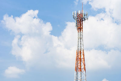 Low angle view of communications tower against sky