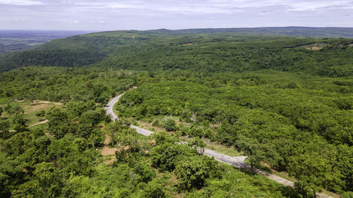 High angle view of landscape and sea against sky