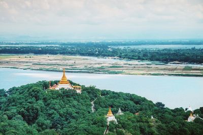 Panoramic view of temple and building against sky