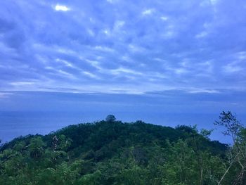 Scenic view of sea against blue sky