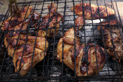 Close-up of meat on barbecue grill