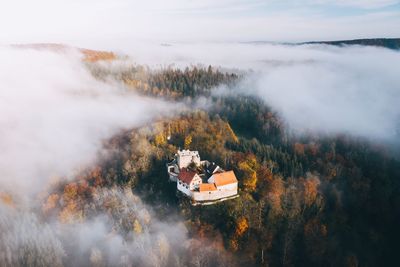 High angle view of trees against sky during foggy weather