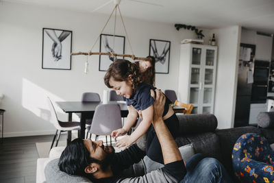 Father playing with daughter