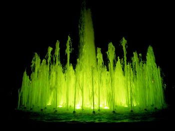 Illuminated lights against black background
