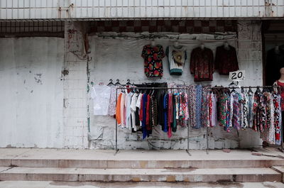 Clothes drying against wall in building