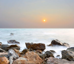 Scenic view of sea against sky during sunset