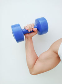 Midsection of man holding paper over white background