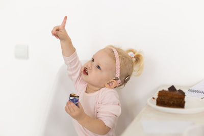 High angle view of cute girl playing with toys on table