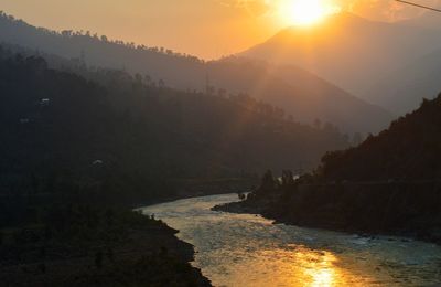 Scenic view of mountains against sky during sunset