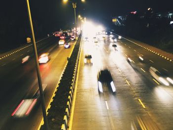 Blurred motion of vehicles on road at night