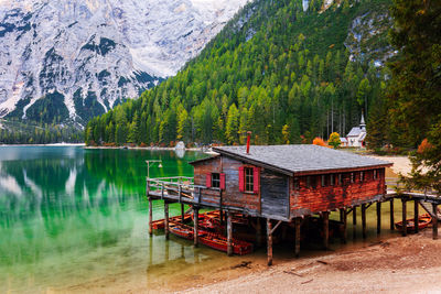 Scenic view of lake against mountains in forest