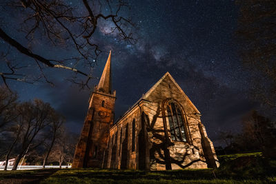 Low angle view of traditional building against sky at night